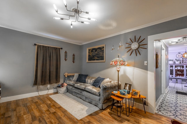 living room with crown molding, wood-type flooring, and a chandelier