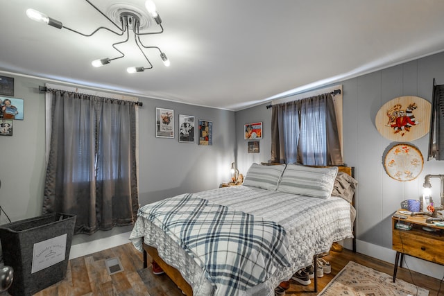 bedroom featuring dark hardwood / wood-style flooring