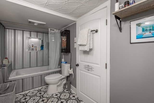 bathroom with shower / bath combination with curtain, toilet, and tile patterned flooring