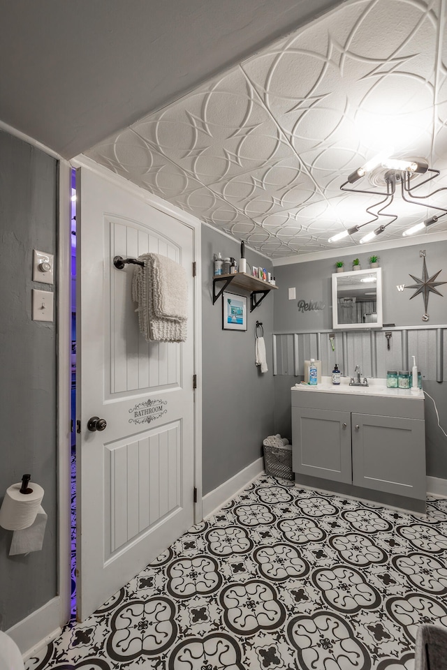 bathroom featuring vanity and ornamental molding