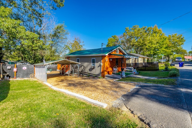 bungalow with a front yard and a carport