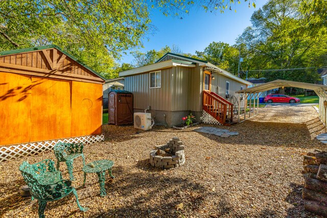 view of side of property featuring ac unit and a carport