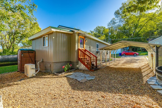 view of side of home featuring a carport