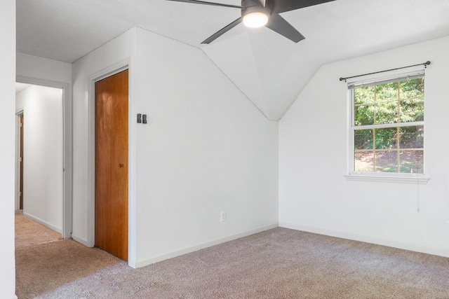 additional living space featuring lofted ceiling, ceiling fan, and light carpet