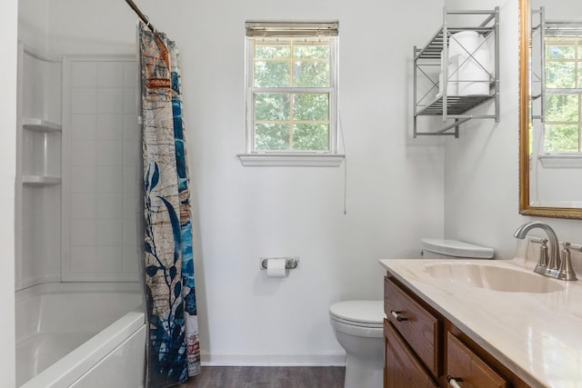 full bathroom featuring vanity, plenty of natural light, toilet, and hardwood / wood-style flooring