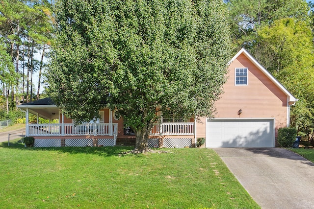 view of front of home featuring covered porch, a front yard, and a garage