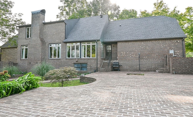 rear view of property with a patio