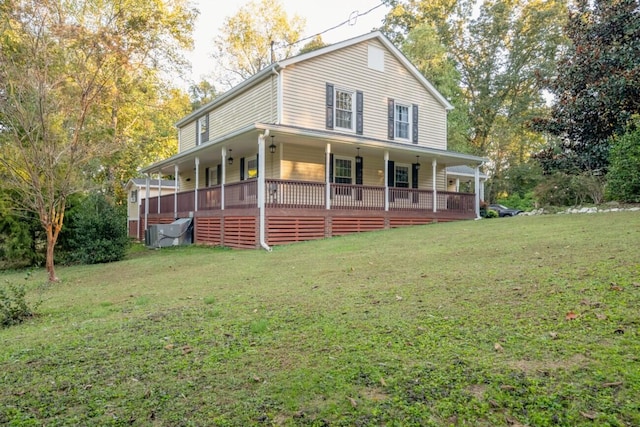 farmhouse inspired home with a front lawn and covered porch