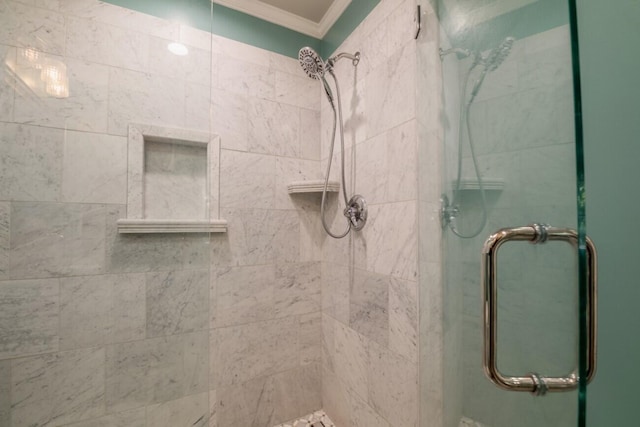 bathroom with walk in shower and ornamental molding