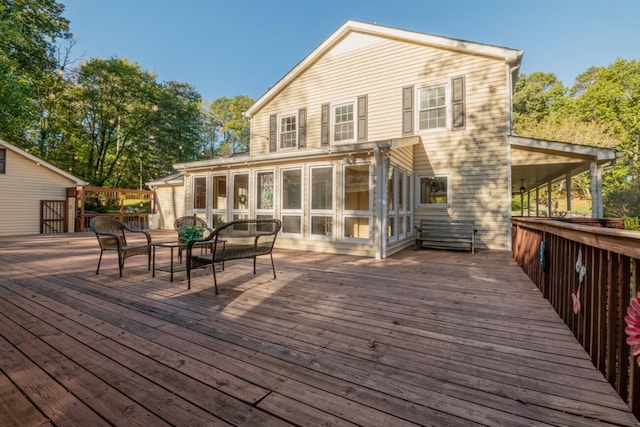 wooden terrace with outdoor dining area