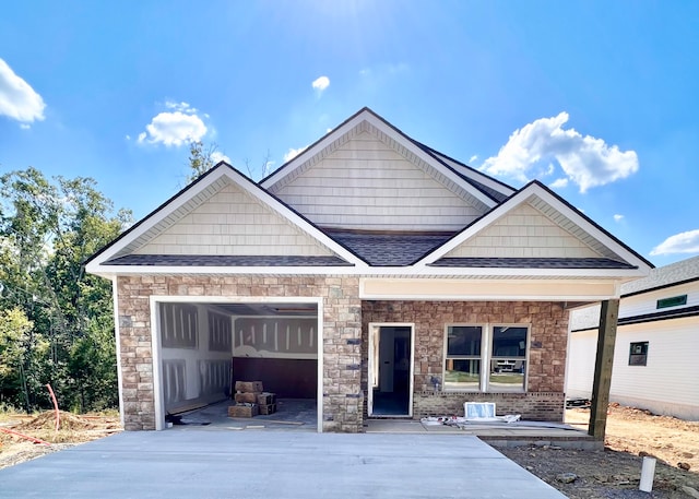 view of front of property featuring a garage