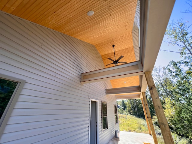 exterior space with a wooden deck and ceiling fan