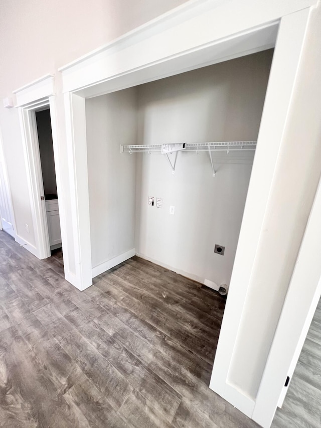 washroom with wood-type flooring and electric dryer hookup