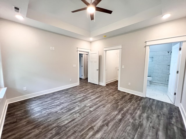 60 Ables Way, Ringgold, GA 30736 - unfurnished bedroom with dark wood-style floors, baseboards, a tray ceiling, ensuite bathroom, and recessed lighting