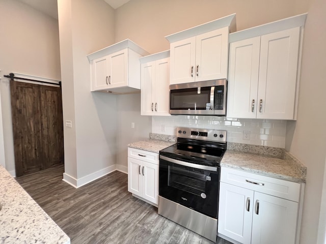 60 Ables Way, Ringgold, GA 30736 - kitchen with stainless steel appliances, baseboards, decorative backsplash, and white cabinetry