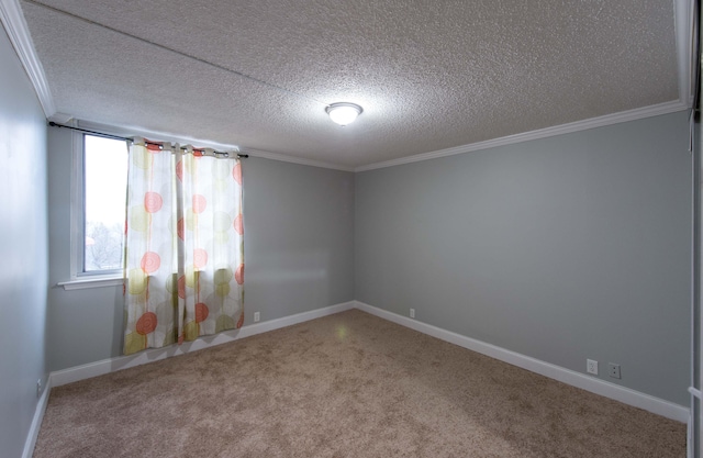 empty room featuring carpet flooring, a textured ceiling, and crown molding