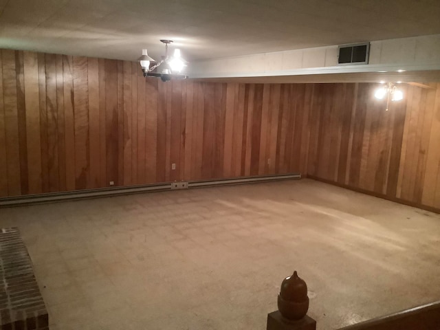 basement with light colored carpet and wooden walls