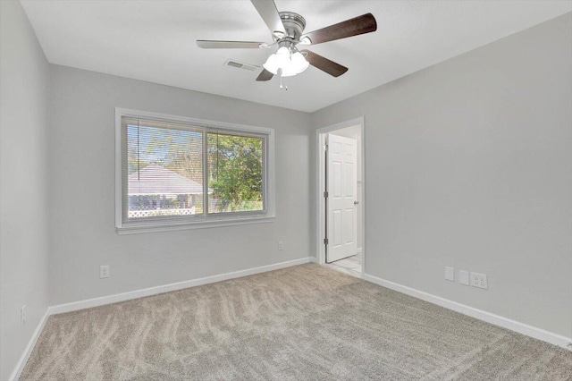 carpeted empty room with ceiling fan