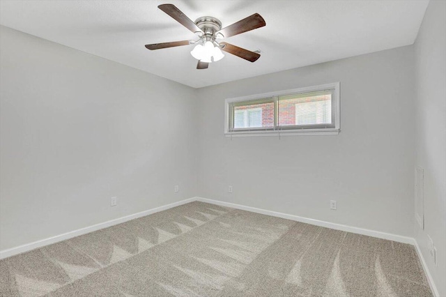 empty room with ceiling fan and carpet floors