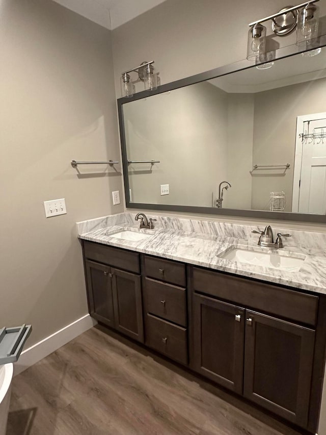 bathroom featuring vanity and hardwood / wood-style flooring