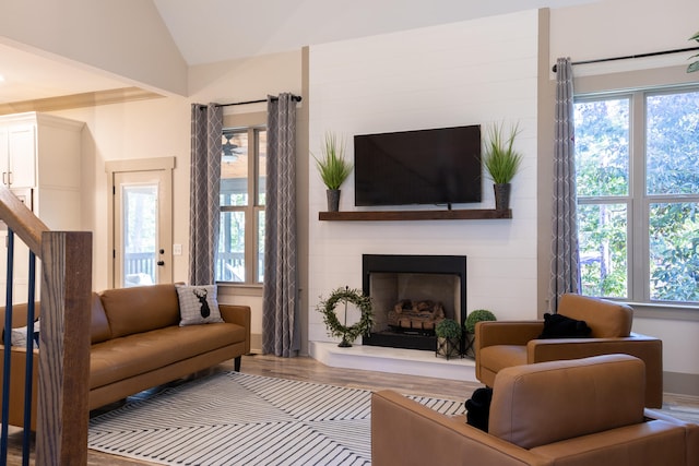 living room with lofted ceiling and hardwood / wood-style flooring