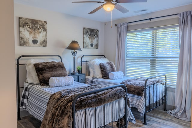 bedroom featuring ceiling fan and hardwood / wood-style floors