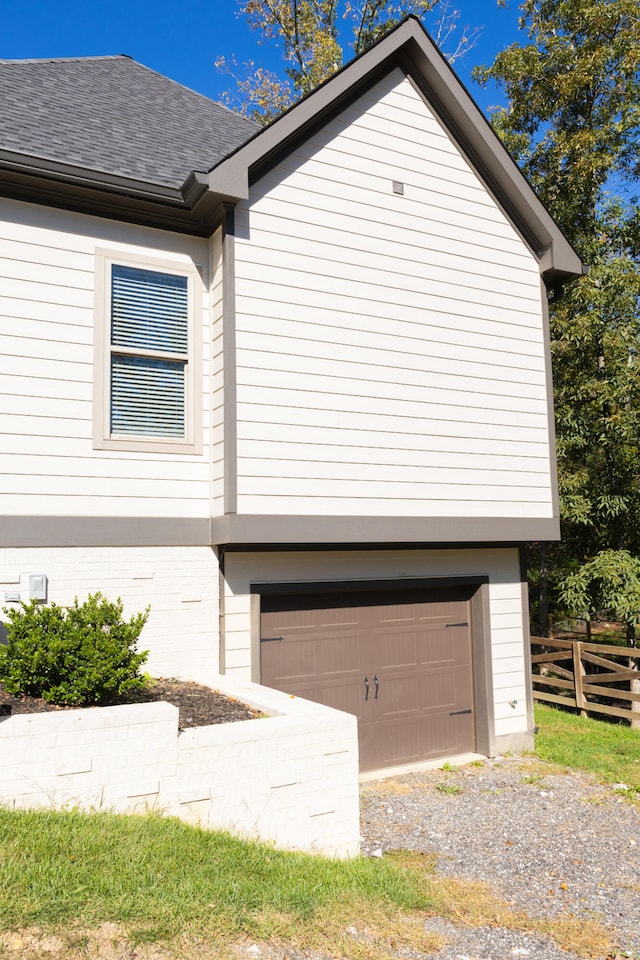 view of side of home featuring a garage