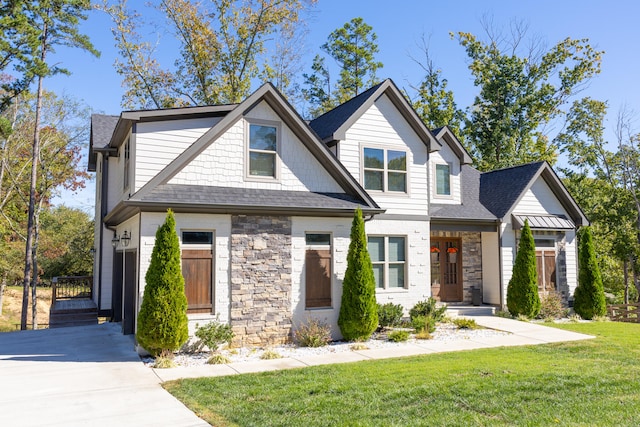 craftsman inspired home with a front yard