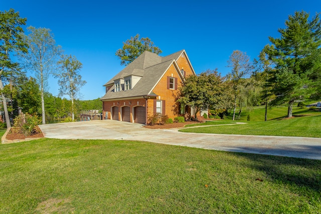 view of side of property featuring a garage and a lawn