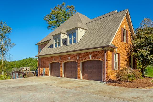 view of side of home with a garage