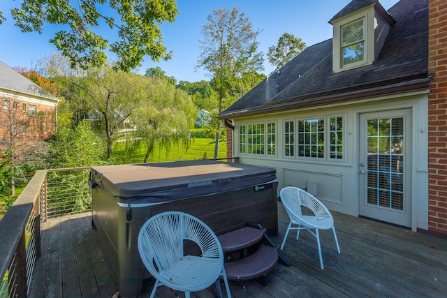 deck featuring a hot tub