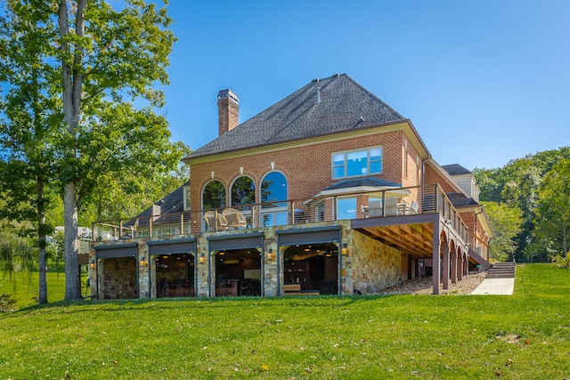 rear view of property featuring a yard and a deck