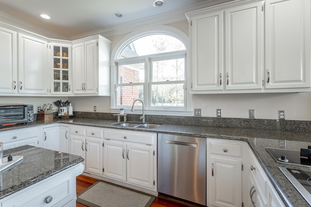 kitchen featuring sink, dishwasher, and white cabinets