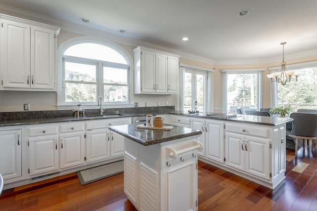 kitchen with a center island and white cabinets