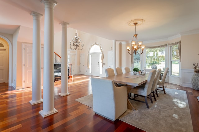 dining space featuring a notable chandelier, dark wood-type flooring, and crown molding