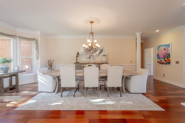 dining area with crown molding, a notable chandelier, and dark hardwood / wood-style flooring