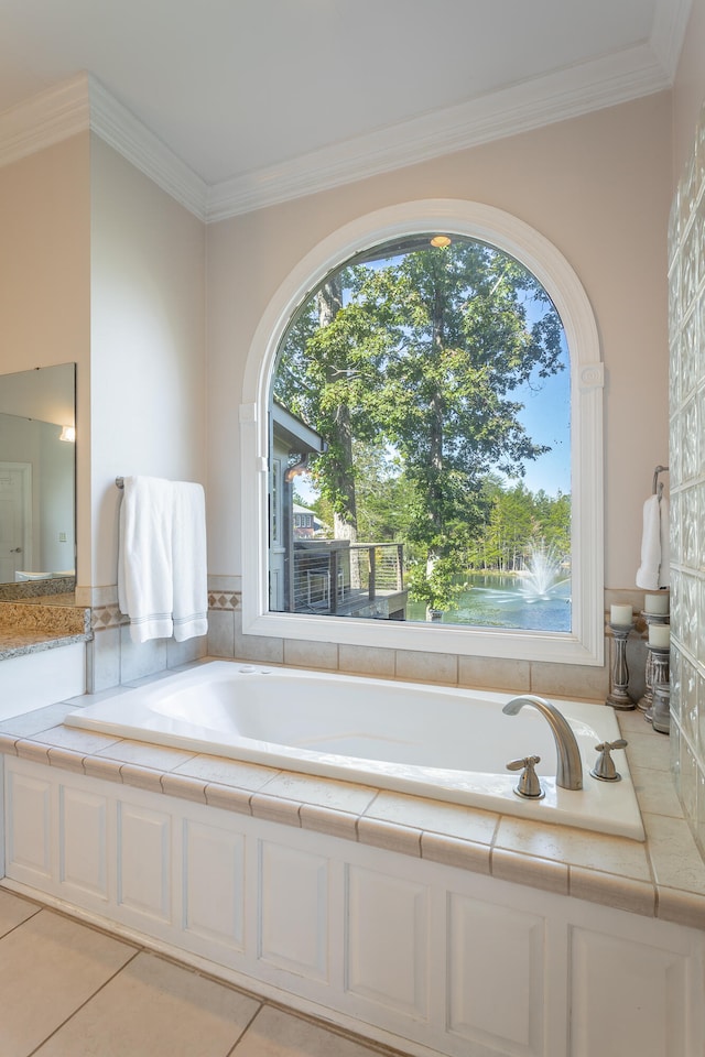 bathroom featuring tile patterned floors, crown molding, and a bathing tub