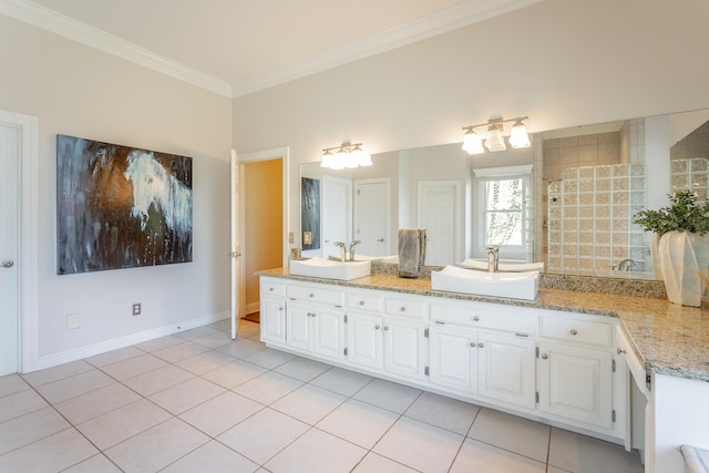 bathroom featuring vanity, ornamental molding, and tile patterned flooring