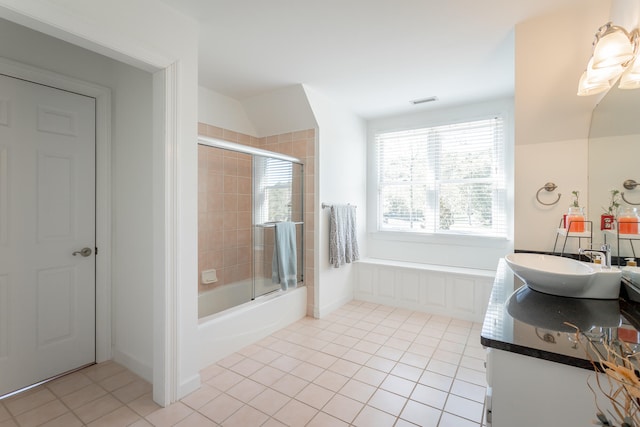 bathroom with vanity, enclosed tub / shower combo, and tile patterned flooring