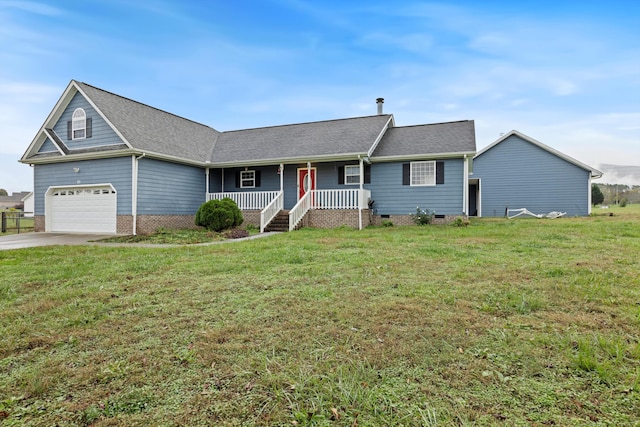 ranch-style home featuring a garage, covered porch, and a front lawn