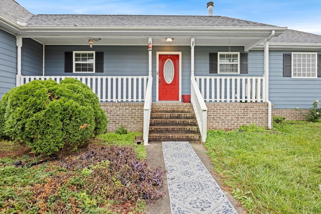 property entrance featuring a porch