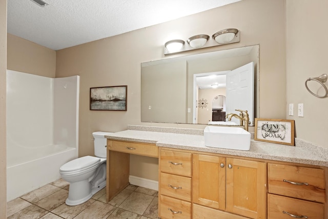 full bathroom with toilet, bathtub / shower combination, vanity, and a textured ceiling