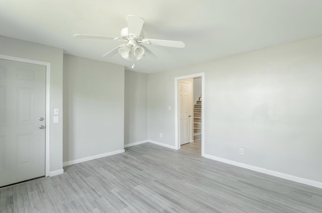 empty room featuring light hardwood / wood-style floors and ceiling fan