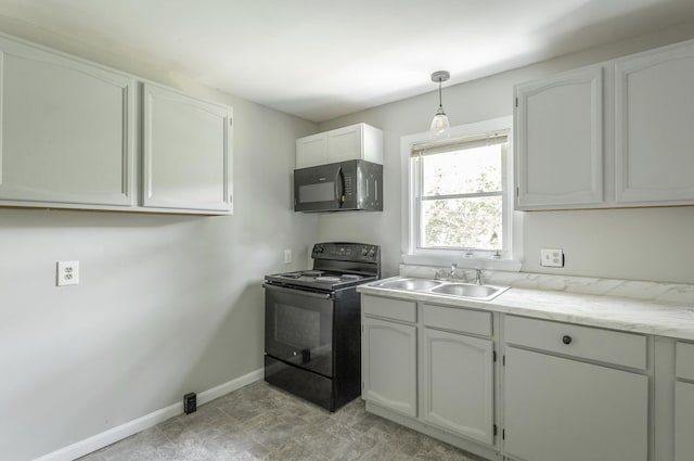 kitchen with white cabinetry, black appliances, sink, and decorative light fixtures