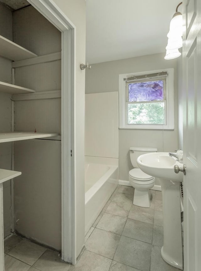 full bathroom with sink, shower / bathing tub combination, and toilet