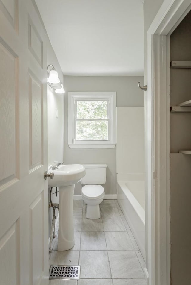 full bathroom with toilet,  shower combination, and sink