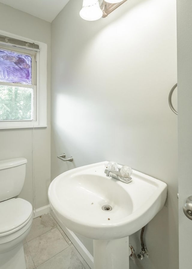 bathroom with toilet and sink