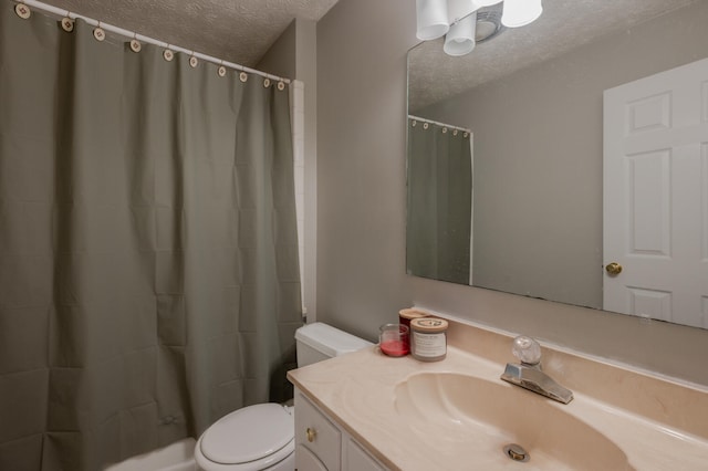 bathroom with toilet, a textured ceiling, curtained shower, and vanity