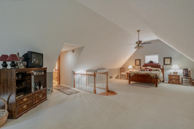 bedroom with lofted ceiling, light colored carpet, and ceiling fan