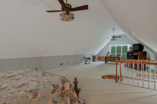 carpeted bedroom featuring ceiling fan and vaulted ceiling